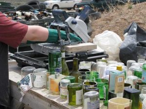 Bottles and cans are cut using a tile saw at the Earthship Biotechture Academy in Taos.