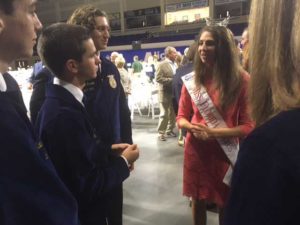 Rachel Smith, Miss Florida Citrus 2017 and a University of Florida graduate student, talks with officers of the Florida Association of the Future Farmers of America in Alico Arena.