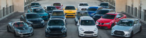 Photo of FGCU Car Club - cars parked on top of parking garage.