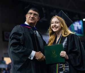 Photo shows FGCU student graduating