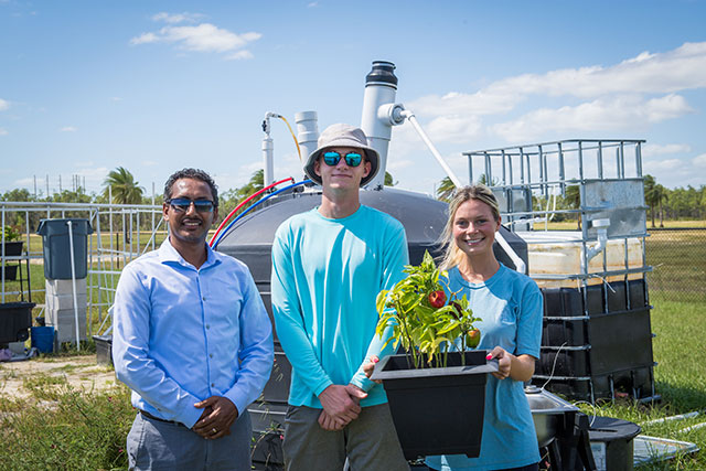 Photo shows FGCU team working on waste to energy project