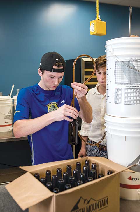 Photo shows student making beer