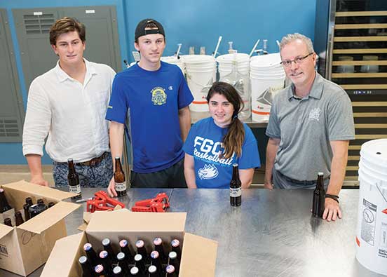 photo shows FGCU students who make beer