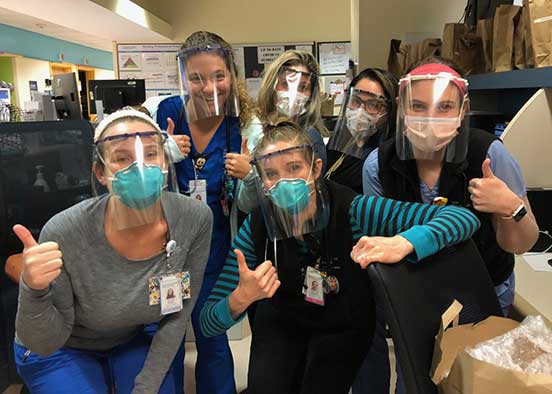 Photo shows healthcare workers wearing face shields