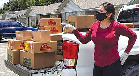 Maria Cardenas (’13, Social Work) helps make sure seniors are safe and have food.