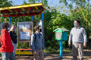 Photo shows students in FGCU Food Forest