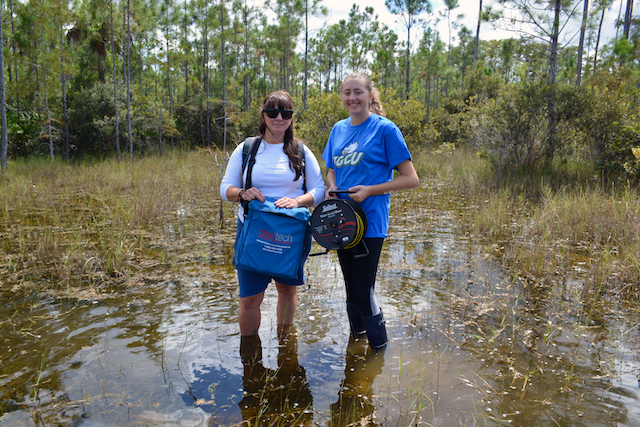 Photo shows FGCU student and faculty member