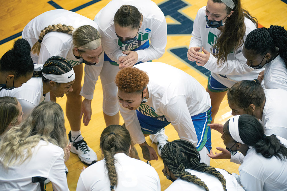 Kierstan Bell ( center) in huddle with team during a game against Michigan last year.