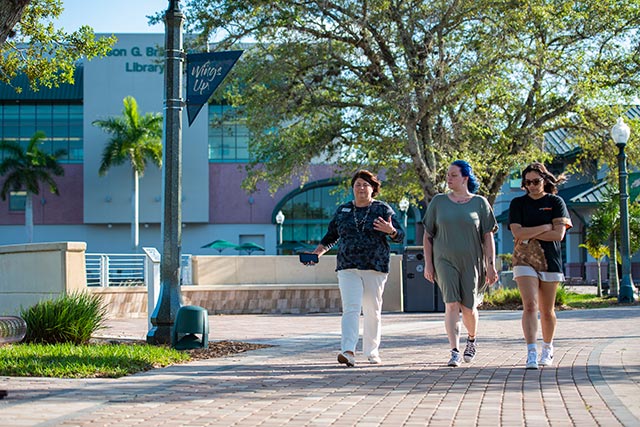 photo shows FGCU students walking