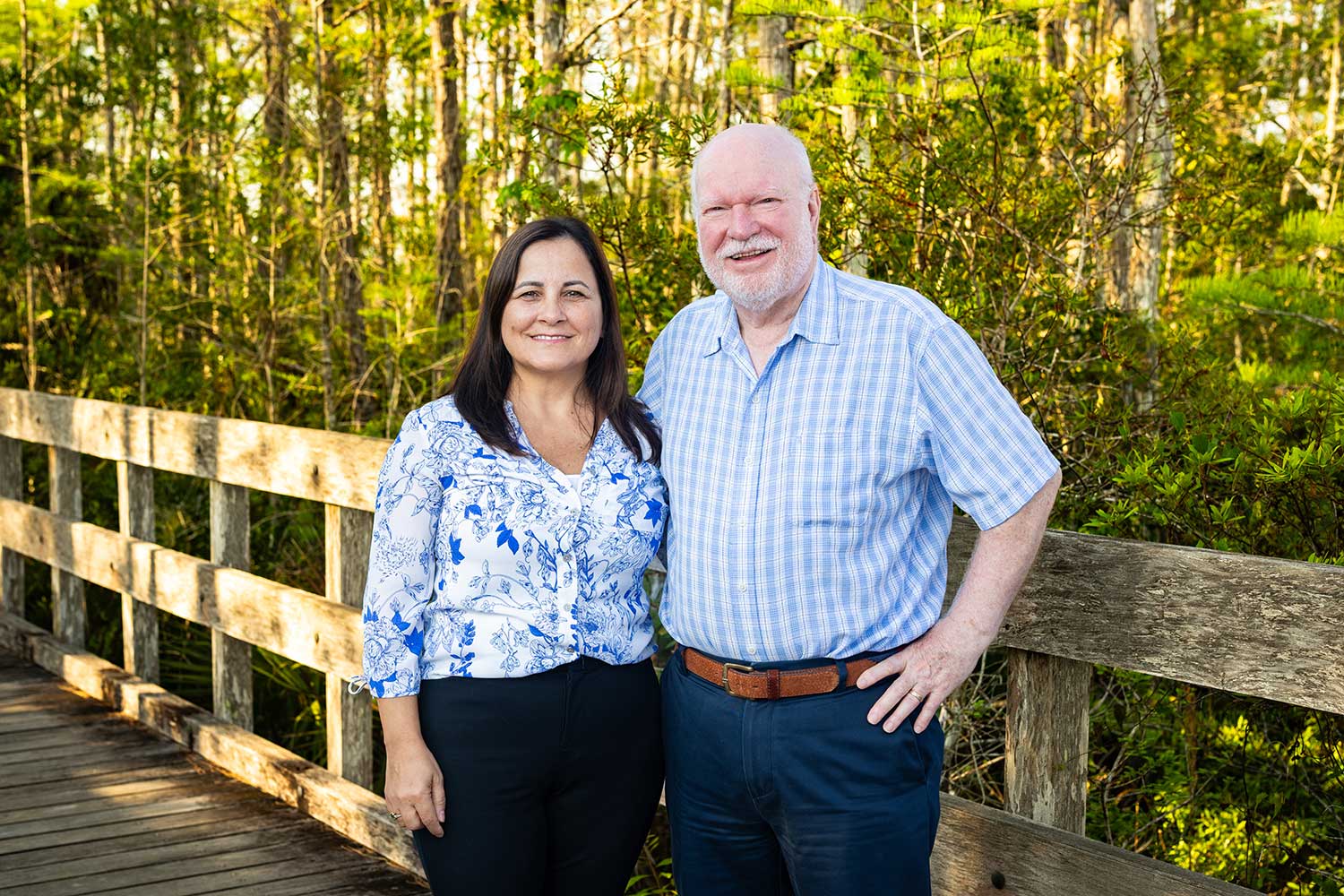 Maria and Thomas M. Missimer stand on a boardwalk on the FGCU campus