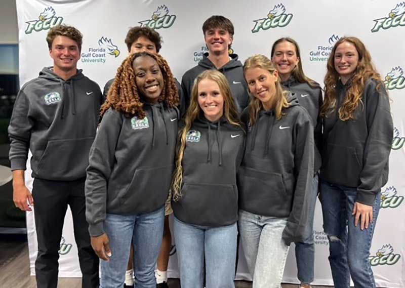 Photo shows 8 FGCU student-athletes posing