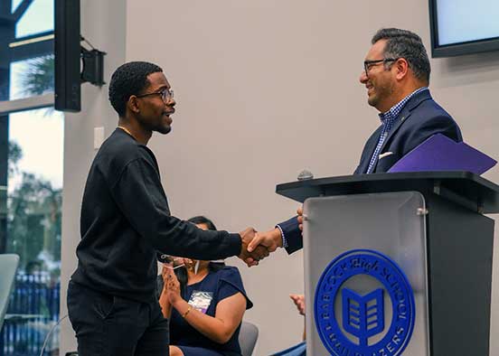 FGCU grad Abraham Joseph winning award