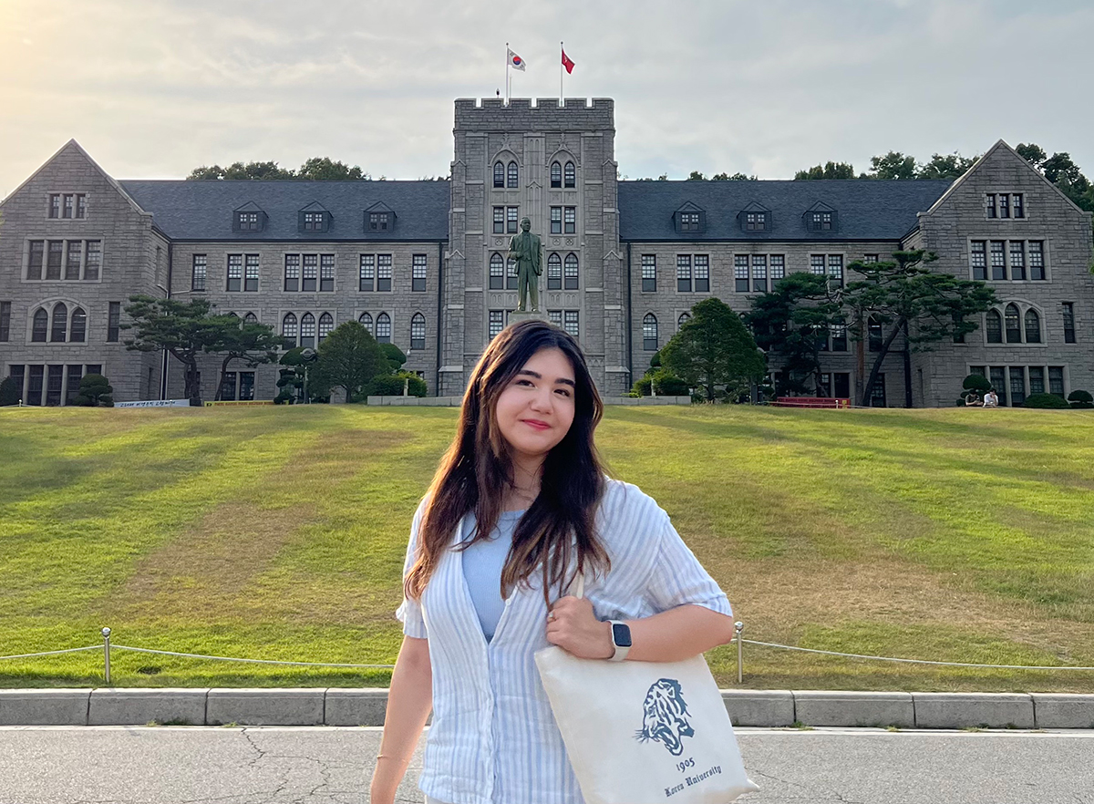 FGCU student standing in front of a campus in Korea