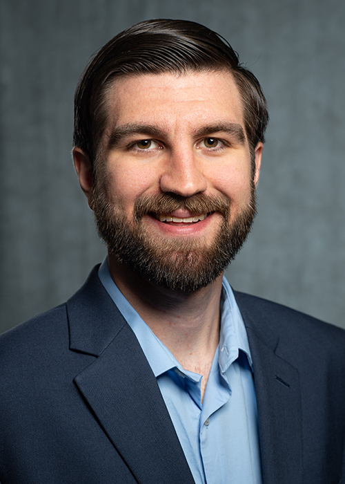 Bearded man in suit jacket