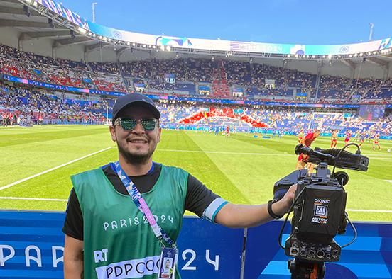 Man with video camera in Olympic stadium in Paris