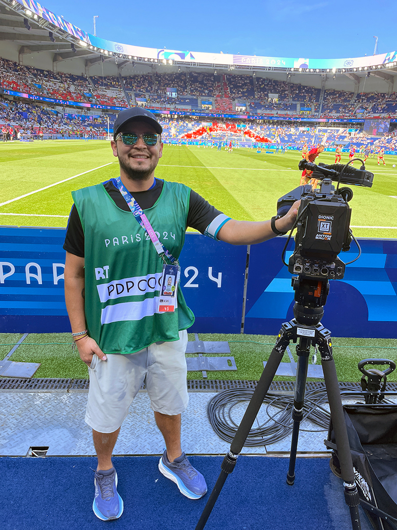 Man with video camera in Olympic stadium in Paris