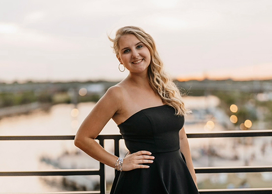 woman in black dress smiling