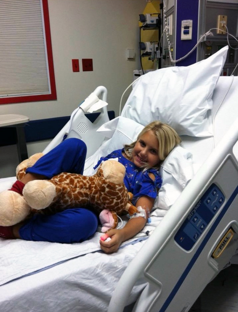 Blond girl in hospital bed