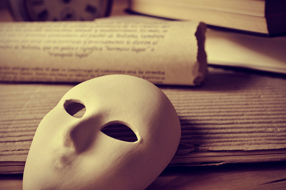 Photo illustration shows a mask and manuscript