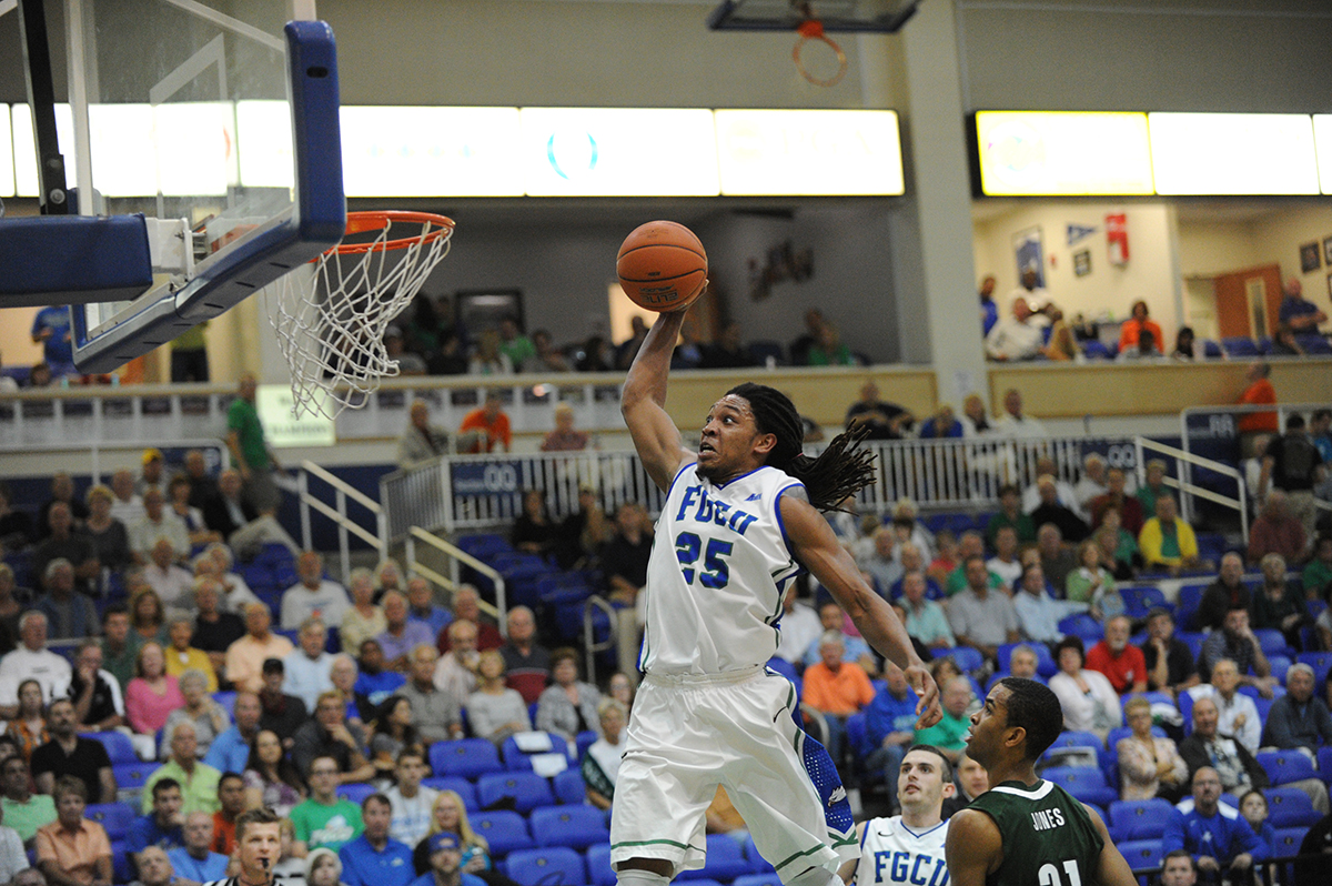 Male basketball player making shot