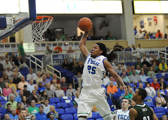 Male basketball player making shot