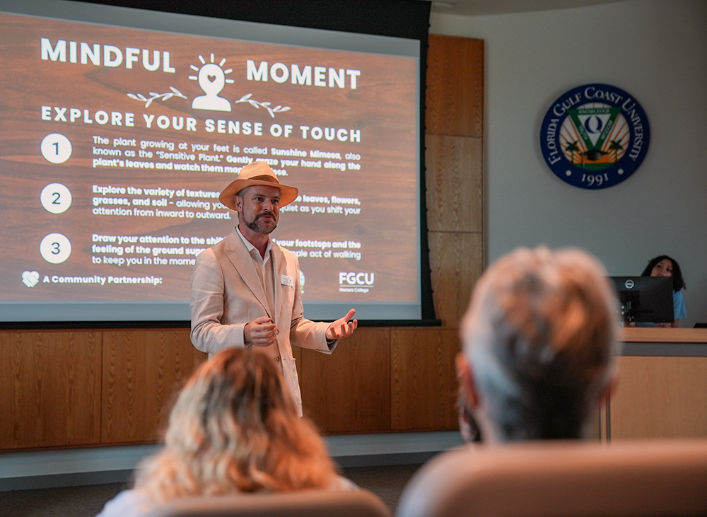 Tyler Fisher, dean of the Honors College, addresses a group gathered to celebrate FGCU's partnership with J.N. "Ding" Darling National Wildlife Refuge. Photo: Cadence Bakker.