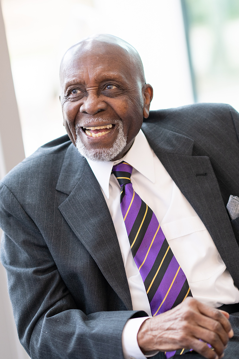 Man in suit and tie smiling