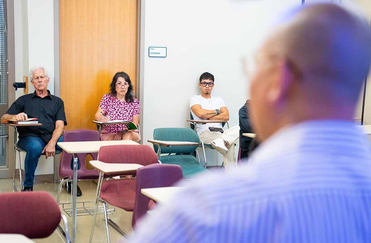 Students sitting in classroom listening to professor