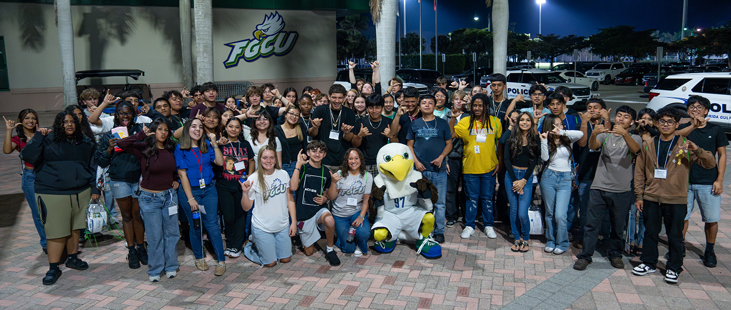 Large group of student standing with FGCU mascot