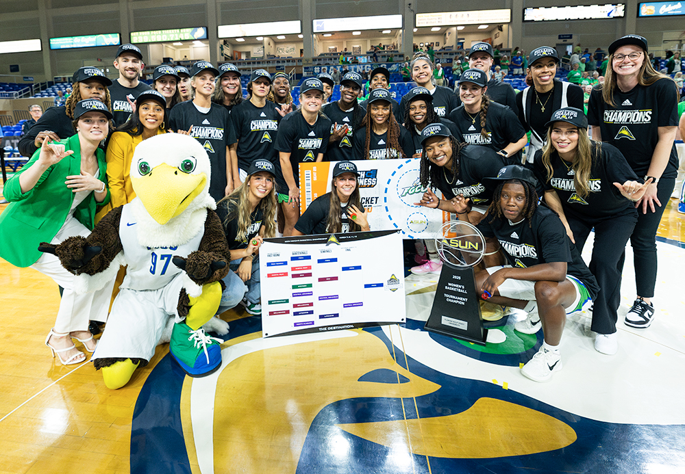 Women basketball players celebrating on court