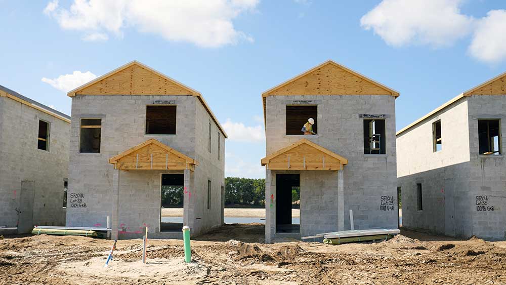Two-story Eagle View Village employee housing cottages under construction by FGCU