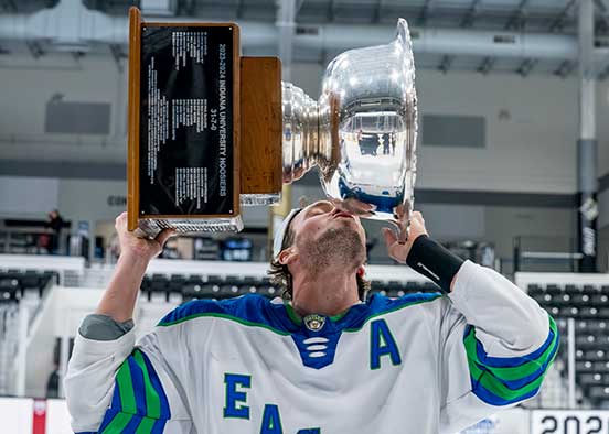 FGCU hockey player kisses ACHA Division II championship trophy on ice