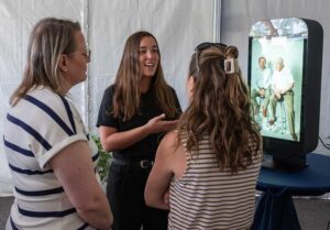 Visitors view healthcare technology exhibit at FGCU campus event