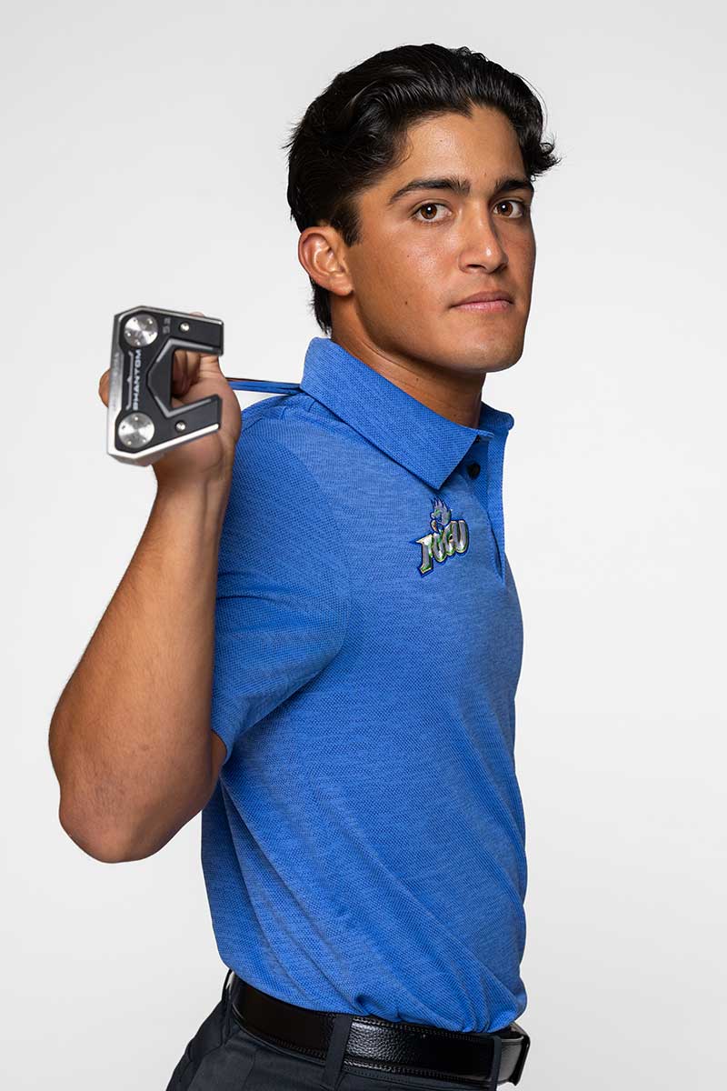 FGCU men’s golfer holding putter during studio portrait shoot