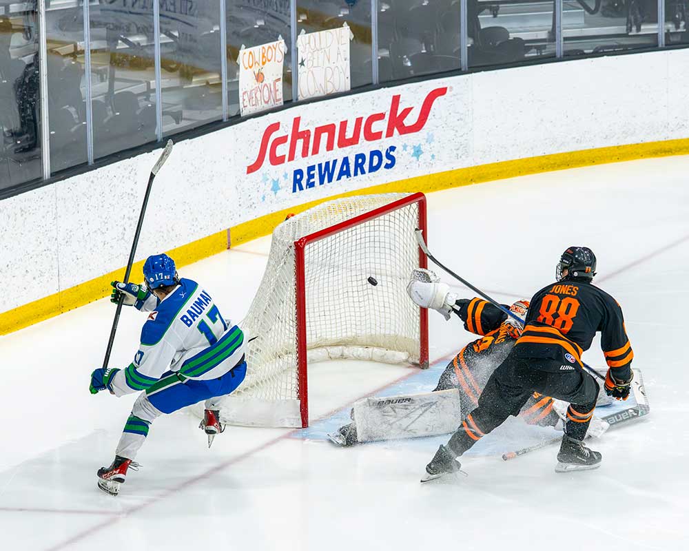 FGCU hockey player scoring goal.