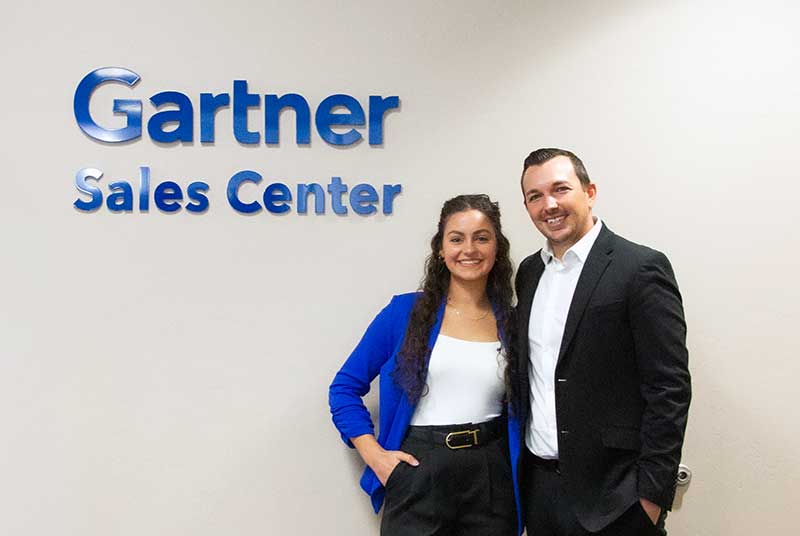 FGCU student at Gartner Sales Center with industry professional