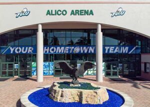 FGCU Alico Arena entrance featuring Eagle statue and “Your Hometown Team” signage