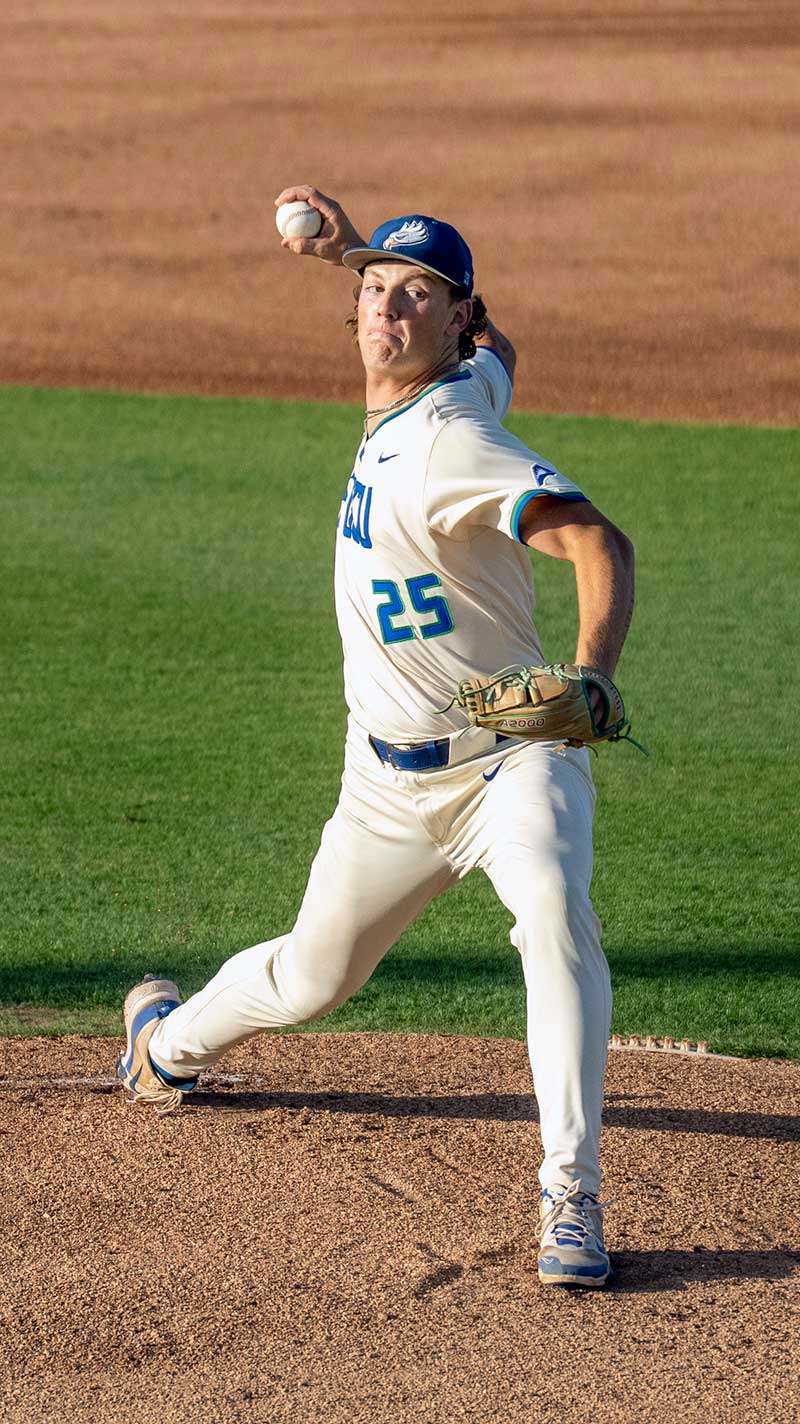 FGCU pitcher delivering pitch from mound during college baseball game action