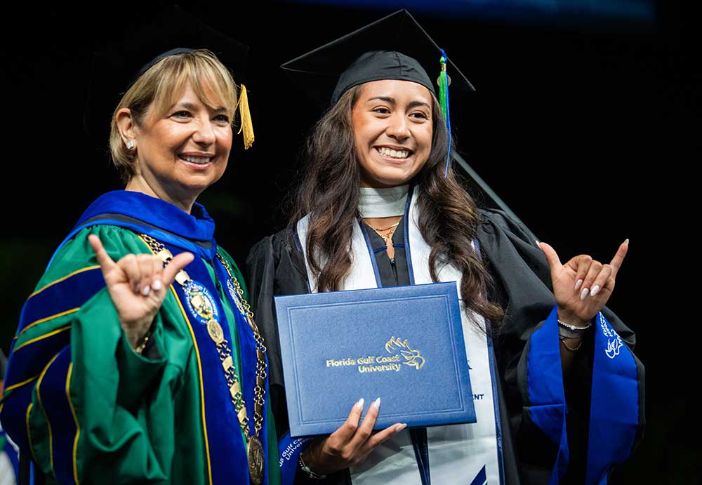 FGCU graduate holds diploma at commencement ceremony