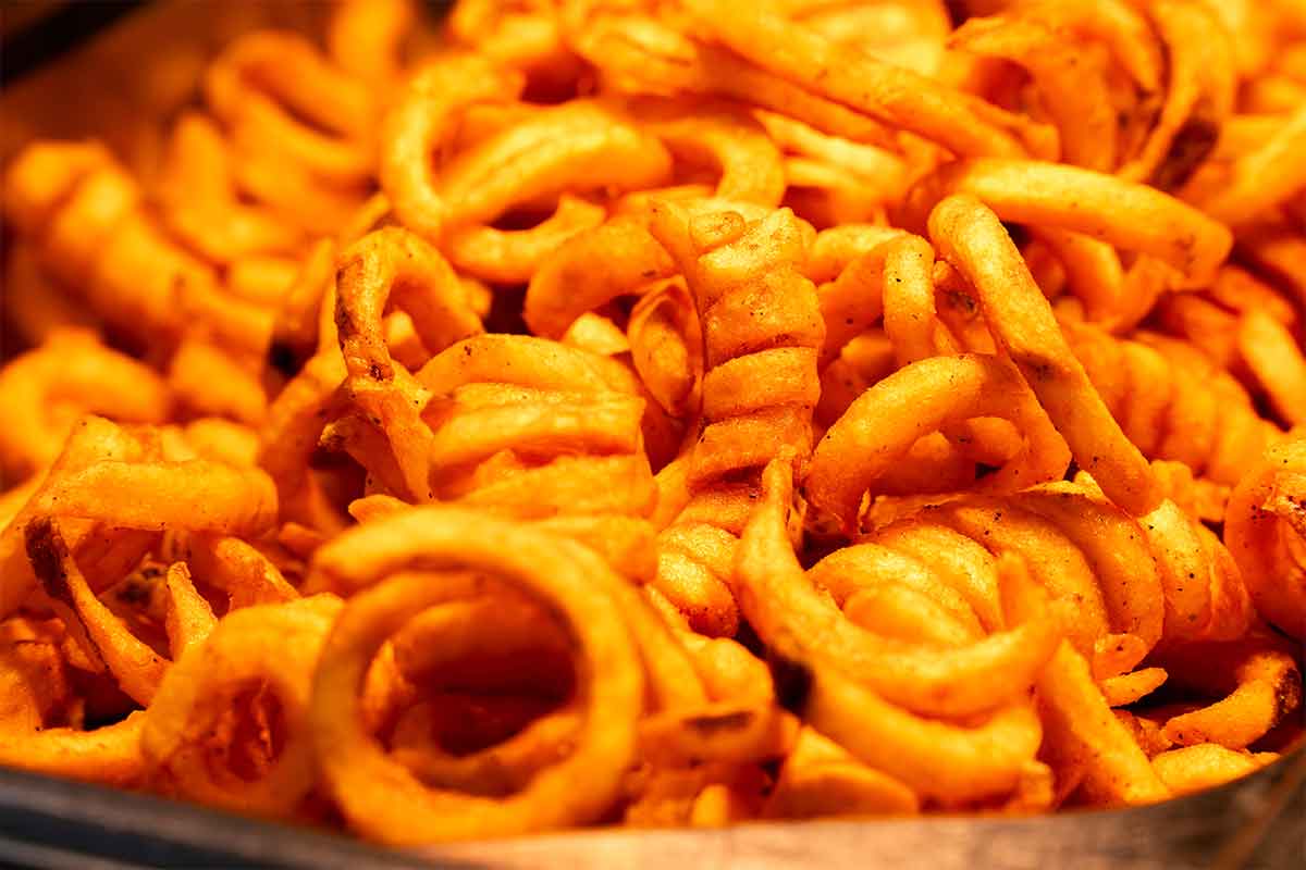 A close-up photo of curly fries