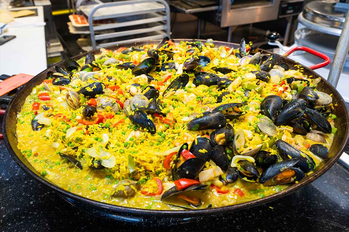 An oversized pan with seafood paella
