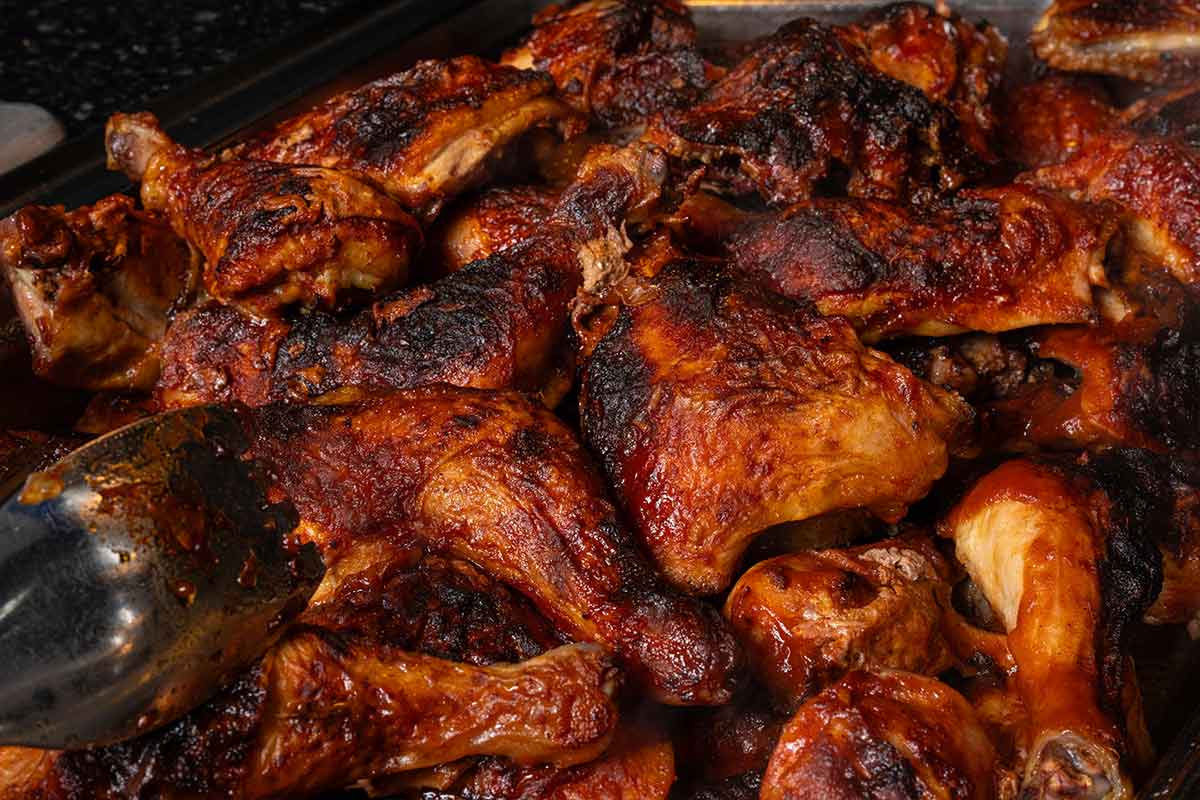 A close-up photo of barbecued chicken pieces