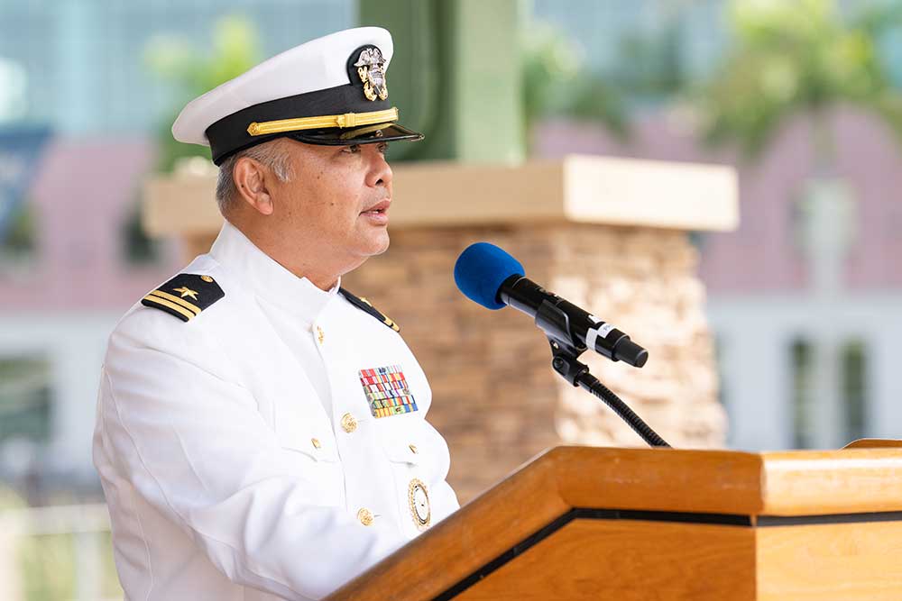Naval officer speaks at Veterans Day ceremony podium at FGCU