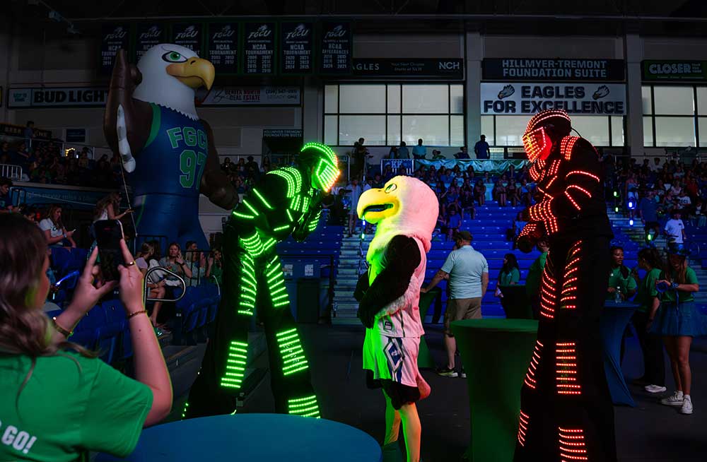 FGCU Eagles mascot and LED performers entertain students at welcome event.