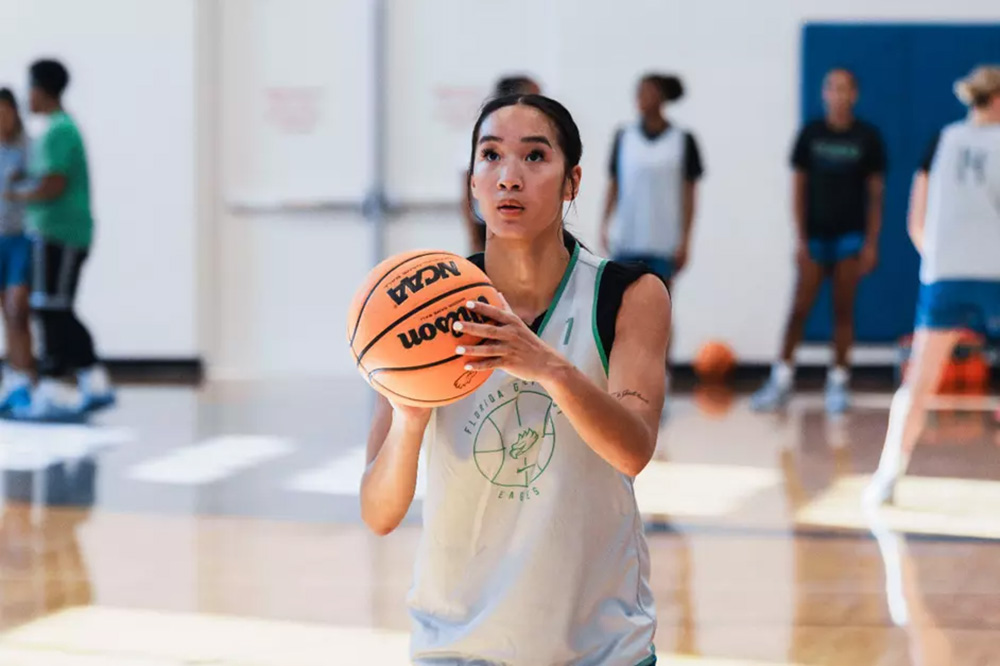 Basketball player holding ball preparing to shoot