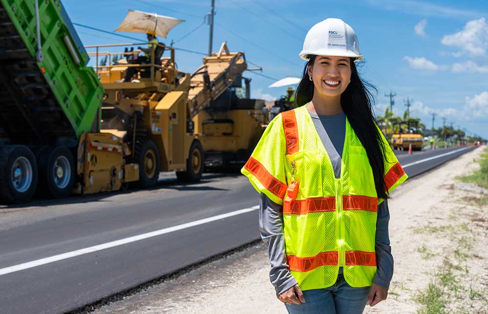 Engineering professional at active road paving project