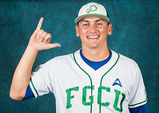 FGCU baseball player poses in team uniform
