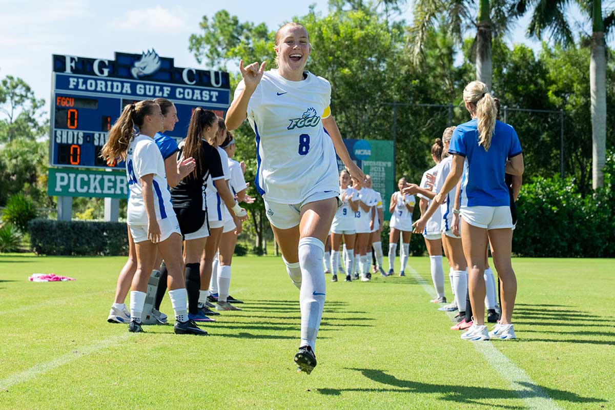 FGCU soccer player runs through pregame introductions